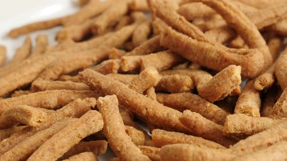 Chilli integral breadsticks fried in oil slow pan 4K 2160p 30fps UltraHD footage - Panning on grissi alt