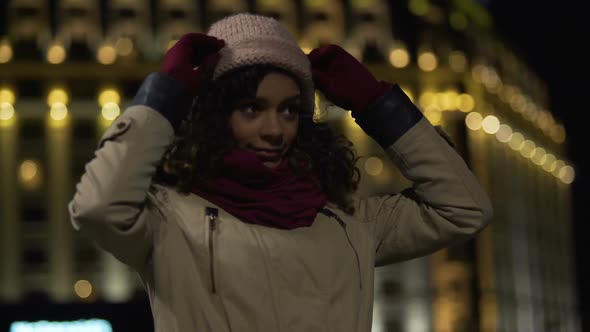 Biracial Girl Sprucing Herself Up, Waiting for Friends to Hang Out in Night City alt