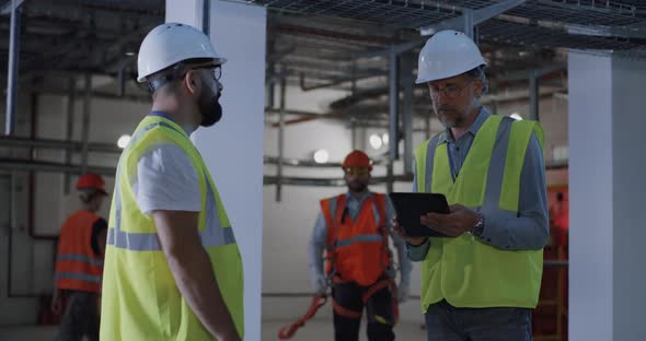 Engineers Discussing Construction of Power Plant alt