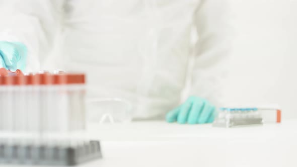 Doctor Pushes Small Shopping Cart with COVID19 Vaccine alt