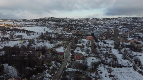 Snowy Village Landscape Drone View alt