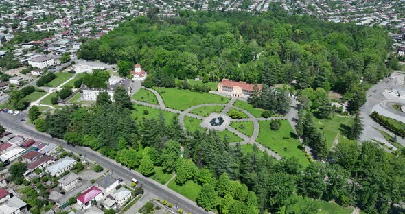 Zugdidi, Georgia - May 30 2022: Aerial view of Dadiani Palace in the center of Zugdidi city alt