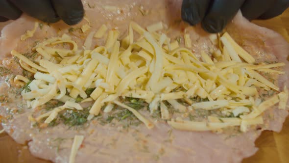 Professional Chef Wrap a Raw Pork Chop With Cheese on Wooden Board alt