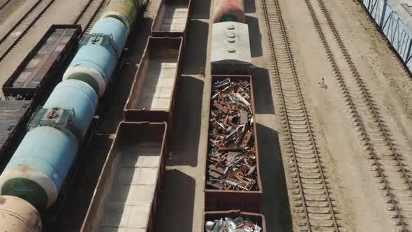 Train Loaded with Scrap Metal Taking Off from Train Yard alt