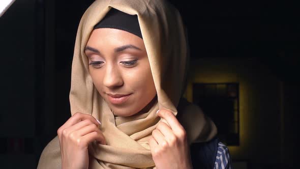 Portrait of an Attractive Young Modern Muslim Woman in Hijab alt