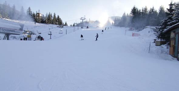 Ski And Snowboarders Enjoying The Ride
