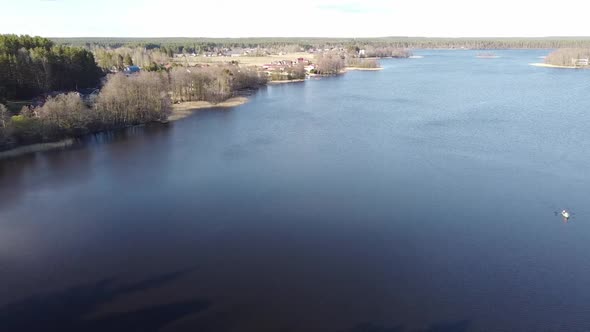 Aerial View of the Lake Borisovskoye, the Forest and the Settlement in Autumn Day, Borisovo