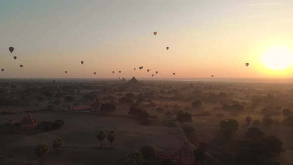 Aerial view of hot balloons in the Old Bagan temple site. alt