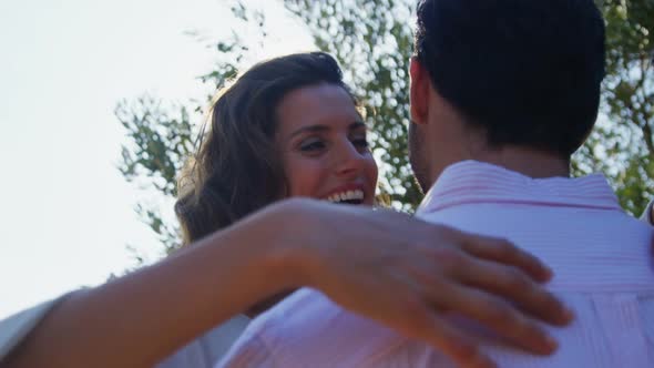 Romantic couple embracing each other in olive farm 4k alt