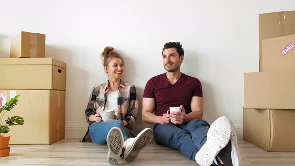 Dreaming couple in their new flat alt