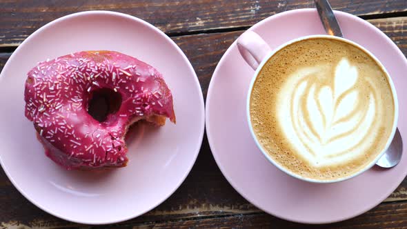 Fresh Vegan Donut With Coffee Latte On Table. Top View. alt