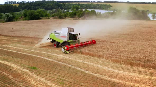 Harvesting Wheat Field at Sunset Wheat Field Combine Agriculture Drone