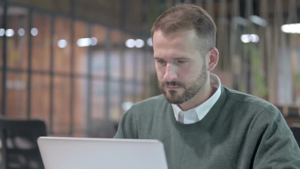 Close Up Shoot of Handsome Man Get Upset While Working alt