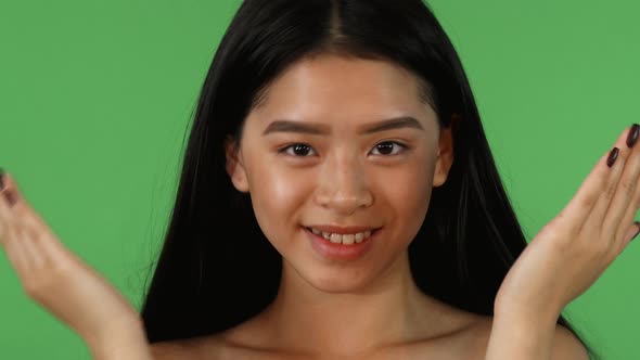 Cheerful Asian Woman Showing Different Emotions at Studio alt