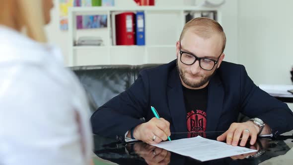 Young Businessmen Sign A Contract. alt