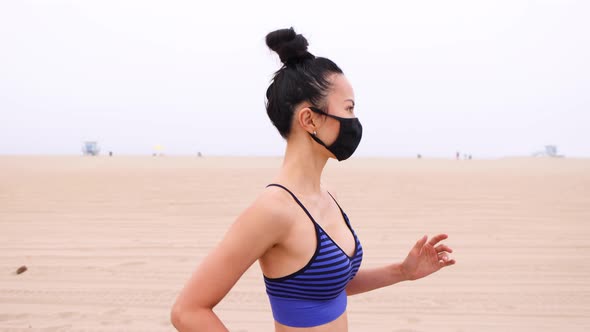 Athletic Asian woman going for her morning workout alt