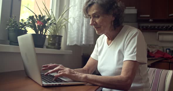 Senior Woman Working on Laptop