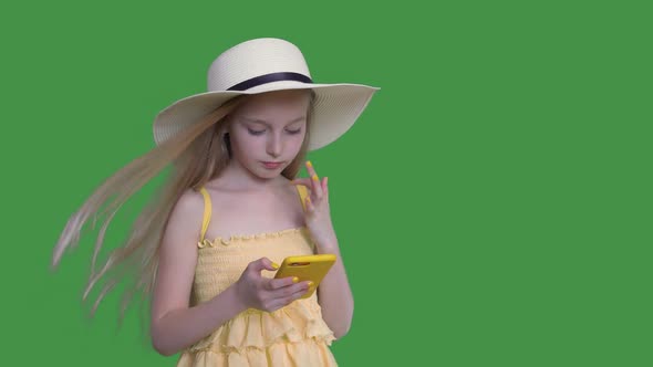 Girl Kid with Fluttering Hair Hold Mobile Phone alt