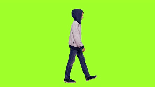 Hooded Teenage Boy Walking