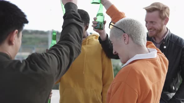 Happy Millennial Friends Drinking Together Outdoors alt