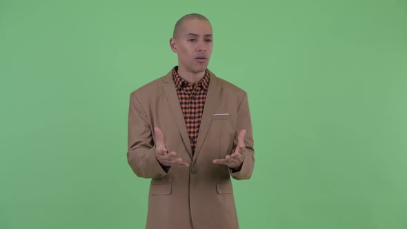 Angry Bald Multi Ethnic Businessman Talking and Complaining alt