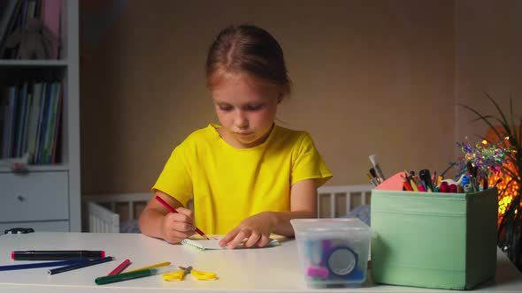 Blonde Girl Draws at Home