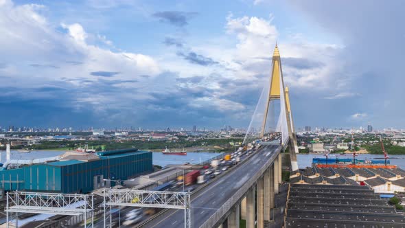 Large suspension bridge over Chao Phraya river with traffic - Time Lapse