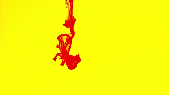 Red Ink Flows Down to Water in Yellow Background