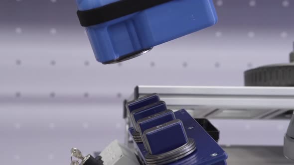 Robotic line at the automobile plant. Robot manipulators collect and weld car bodies alt