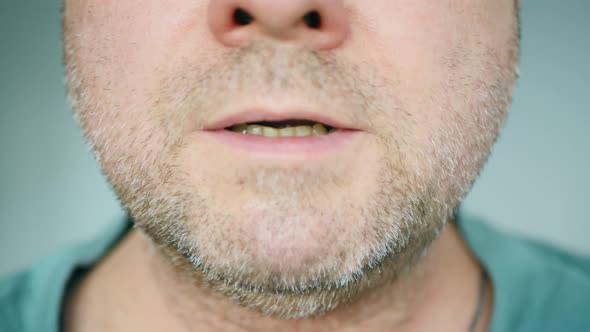 A sick man badly coughing. Close-up of a hospital patient face. Asthma bronchitis patient suffocates