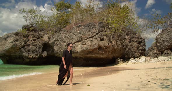 Girl Walking on the Fantastic Beach at Bali Indonesia alt