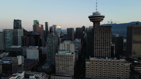 aerial drone footage of downtown Vancouver buildings, gas town, early sunrise, morning urban view. ( alt