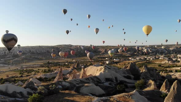 Aerial Hot Air Balloons Flying Over Hoodoos and Fairy Chimneys in Goreme Valley Cappadocia, Turkey alt
