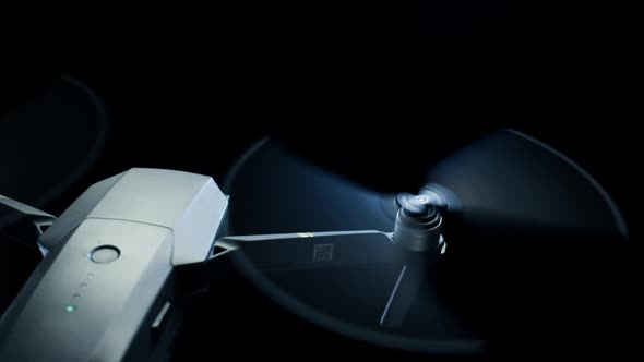 Close-up Spinning Drone Propellers on Black Background. Modern Technologies for Shooting Photos and alt