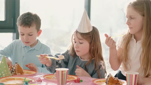 Group of Children Eating at Birthday Party in Funny Decorations, Stock ...