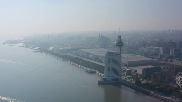 Aerial View of Lisbon and Vasco Da Gama Tower Early Morning with a Haze of Fog alt