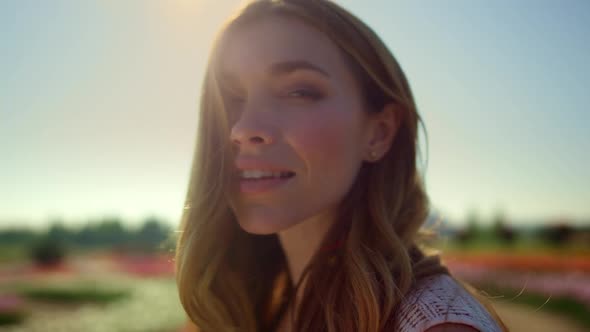 Portrait of Beautiful Girl Smiling in Blue Sky Background alt