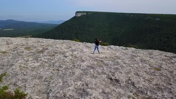 Female Hiker with Siberian Husky Dogs in Mountains Have Fun and Play alt