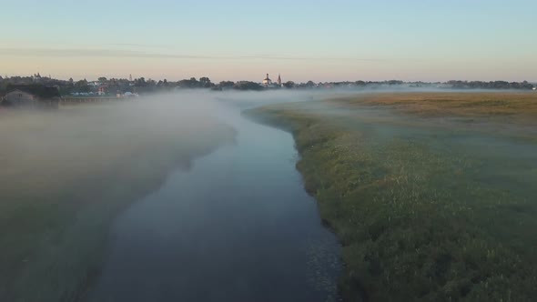 Aerial View of the Fog Over the River at Dawn