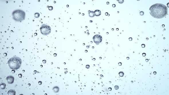 Super Slow Motion Macro Shot of Rising Various Bubbles in Water at 1000 Fps alt