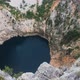 Wonderful karst Red Lake Crveno jezero in Croatia. Cliffs and Forest