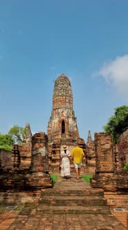 Ayutthaya Thailand at Wat Ratchaburana Couple Men and Women with a Hat Visiting Ayyuthaya Thailand alt