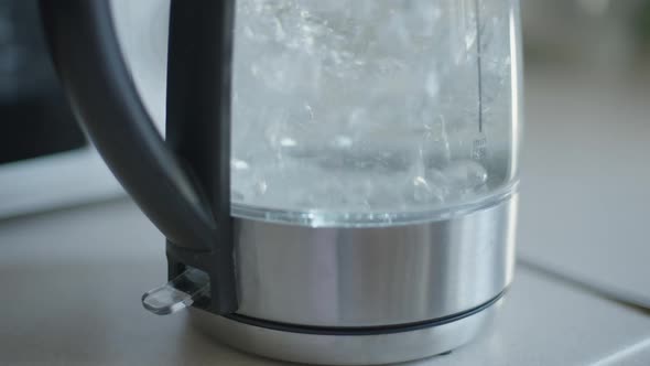 Electric Kettle Turning Off Automatically As Water Boiling Inside Closeup alt