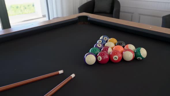 Closeup of a Billiard Table with Balls and Cue for Gambling Indoors