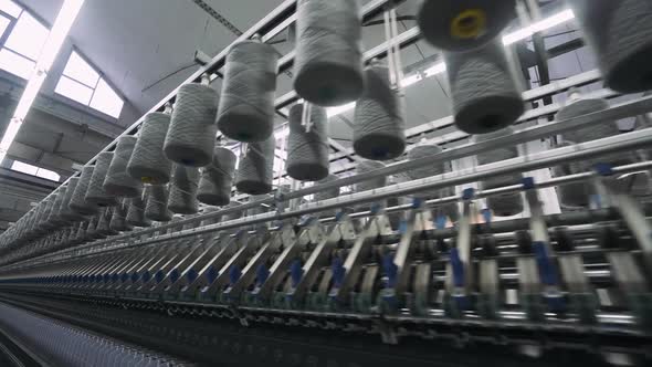 Spinning Factory Production of Fabrics Thread of Silk Linen and Synthetics View of Spools of Thread alt