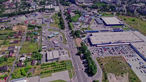 Drone Aerial View of Crossroad in Modern City in Rush Hour alt