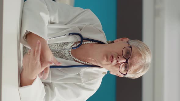 Vertical Video POV of Doctor Meeting with Patient on Video Call Conference alt