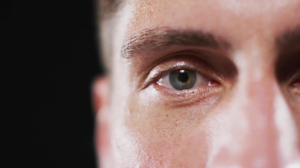 Close up portrait of face of caucasian man with focus on eye alt