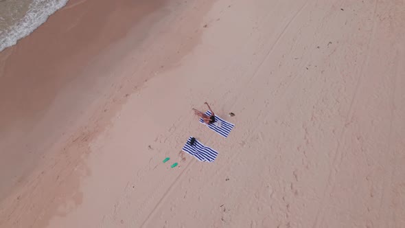 Woman Sitting On Towel On Nacpan Beach alt