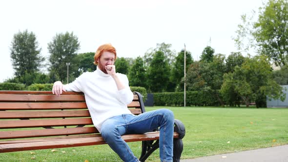 Sick Man Coughing, Sitting in Park, Red Hairs and Beard alt